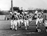 In a scene from old game film, The Citadel Bulldogs take the field in 1972.